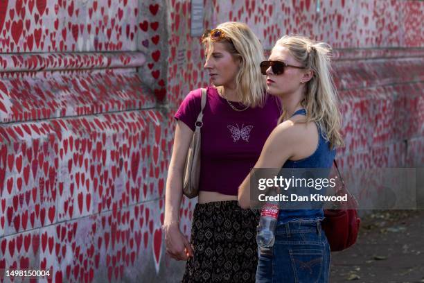 Members of the public near the Covid memorial wall on June 13, 2023 in London, England. In his opening statement the Covid-19 counsel, Hugo Keith KC,...