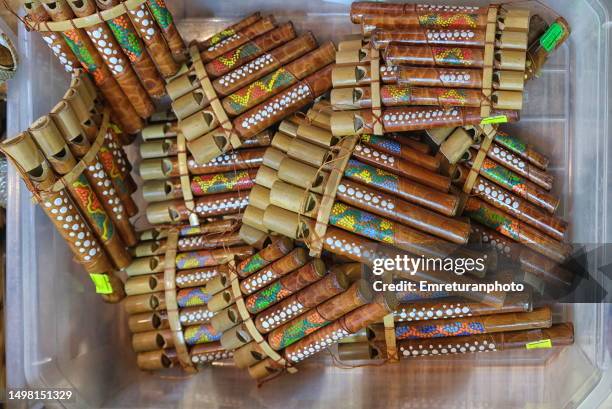 close up of pan pipes for sale in a box in the bazaar market. - flute musical instrument stock pictures, royalty-free photos & images