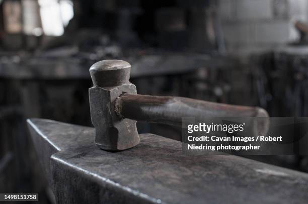 hammer on anvil at blacksmith shop - anvil stock pictures, royalty-free photos & images