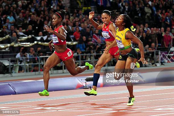 Shelly-Ann Fraser-Pryce of Jamaica crosses the line to win the gold ahead of Allyson Felix of the United States and Tianna Madison of the United...