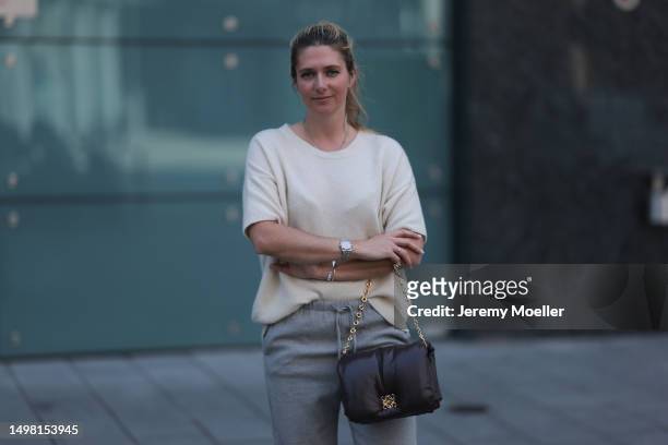 Josephine wearing SoSue beige wide-cut shirt, grey SoSue pants, black Loewe bag with a golden chain, silver jewelry on June 08, 2023 in Hamburg,...
