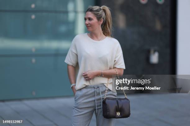 Josephine wearing SoSue beige wide-cut shirt, grey SoSue pants, black Loewe bag with a golden chain, silver jewelry on June 08, 2023 in Hamburg,...