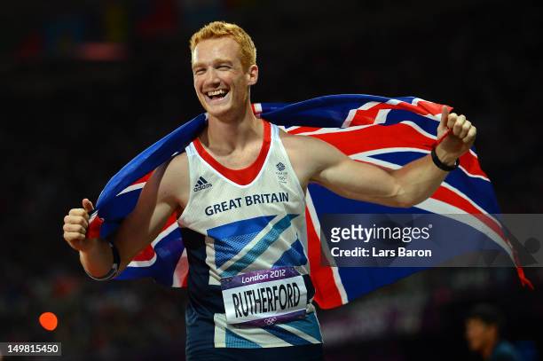 Greg Rutherford of Great Britain celebrates winning gold in the Men's Long Jump Final on Day 8 of the London 2012 Olympic Games at Olympic Stadium on...