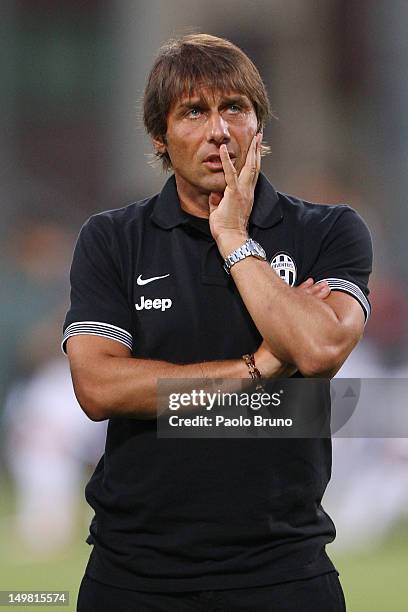 Antonio Conte the coach of FC Juventus looks on during the pre-season friendly match between FC Juventus and Malaga CF at Stadio Arechi on August 4,...