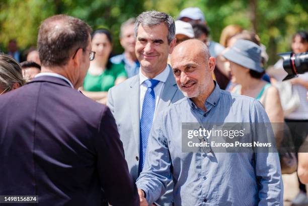 The president of the Xunta de Galicia, Alberto Nuñez Feijoo, greets a man during the presentation of the list heads to the Congress of Deputies with...