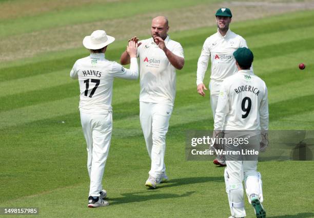 Joe Leach of Worcestershire celebrates the wicket of Tom Haines of Sussex after they were caught out by Gareth Roderick of Worcestershire during the...