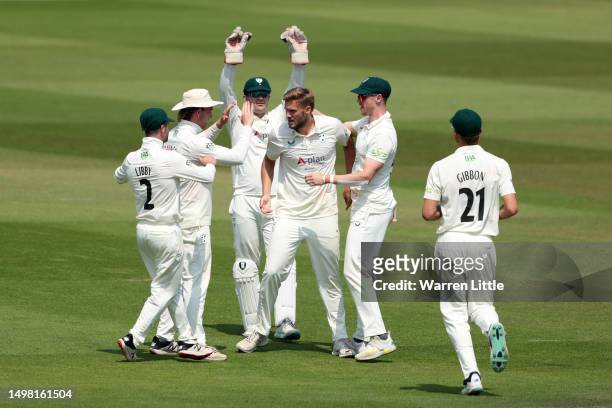 Adam Finch of Worcestershire celebrates with teammates after the wicket of Oli Carter of Sussex during the LV= Insurance County Championship Division...