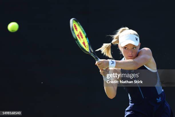 Katie Swan of Great Britain plays a backhand in the Women's Singles Round of 32 match against Alize Cornet of France during Day Two of the Rothesay...