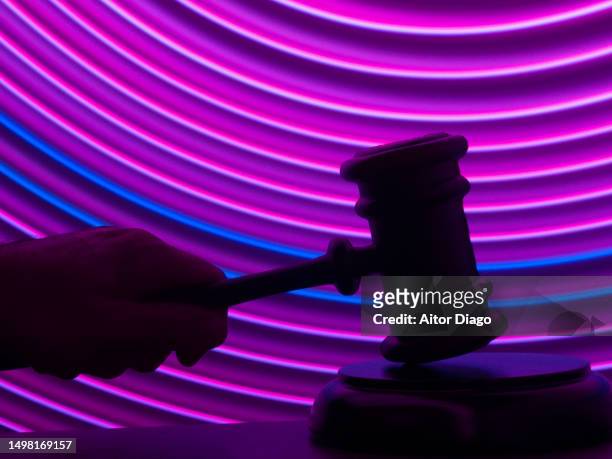 a judge rules. modern purple lines in the background. - lawsuit stock pictures, royalty-free photos & images
