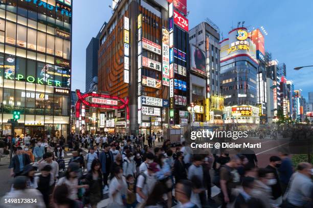 crowd in shinjuku in tokyo in japan - didier marti stock pictures, royalty-free photos & images