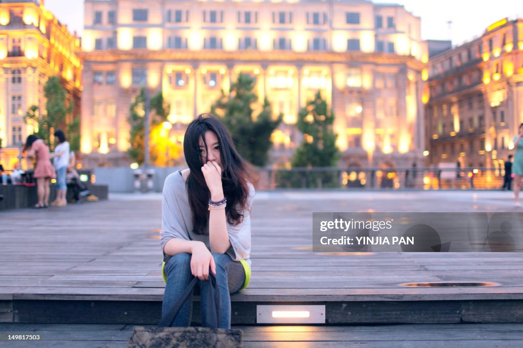 Woman sitting at The Bund