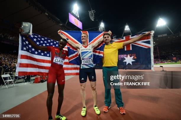 Silver medalist US' Will Claye, gold medalist Britain's Greg Rutherford and bronze medalist Australia's Mitchell Watt celebrate after the men's long...