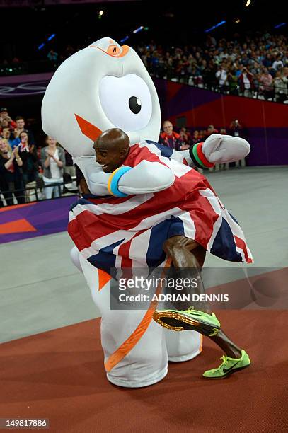 Britain's Mohamed Farah celebrates with mascot Wenlock after winning the men's 10,000m final at the athletics event of the London 2012 Olympic Games...
