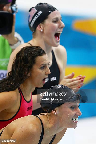 Dana Vollmer, Missy Franklin, and Rebecca Soni of the United States cheer on team mate Allison Schmitt in the Women's 4x100m Medley Relay on Day 8 of...