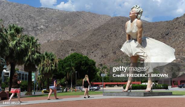 People visit the 'Forever Marilyn' statue of actress Marilyn Monroe in Palm Springs, California, on August 4 a day ahead of the 50th anniversary of...