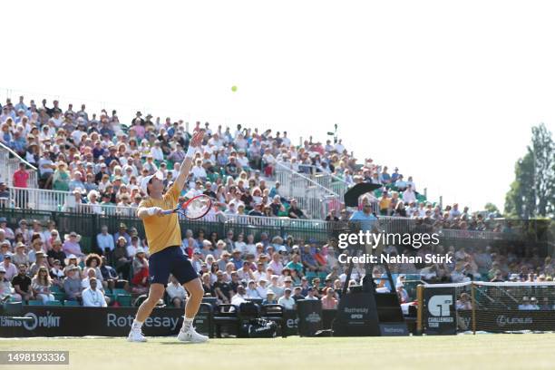 Andy Murray of Great Britain serves in the Men's Singles Round of 32 match against Joris De Loore of Belgium during Day Two of the Rothesay Open...