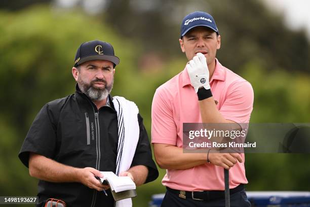 Martin Kaymer of Germany looks on with during caddie Craig Connelly during a practice round prior to the 123rd U.S. Open Championship at The Los...