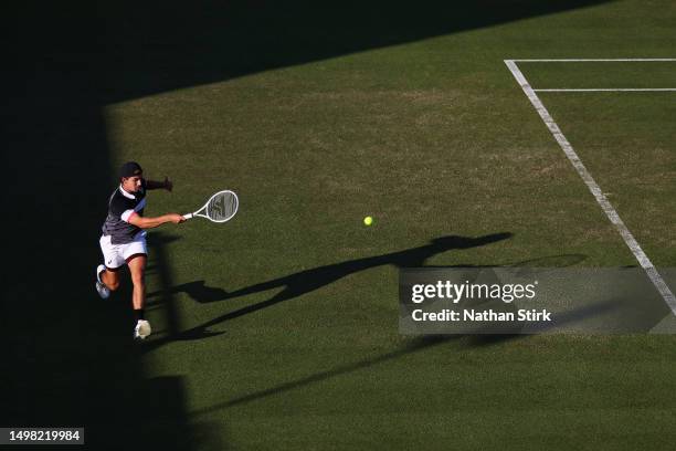 Zachary Svajda of the United States plays a forehand in the Men's Singles Round of 32 match against Thanasi Kokkinakis of Australia during Day Two of...