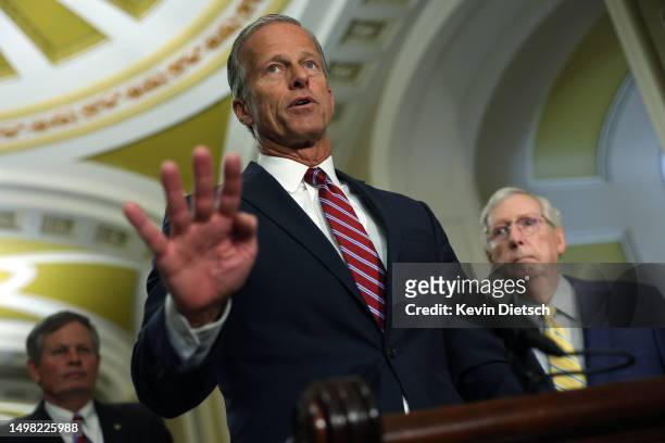 Sen. John Thune , joined by Senate Minority Leader Mitch McConnell and Sen. Steve Daines , speaks to reporters following the weekly Senate policy...