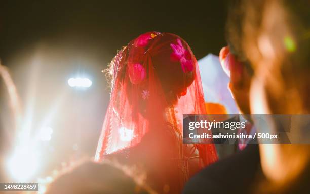 Young Couple Wearing Traditional Clothing Dancing During Wedding Ceremony India, Foto de stock