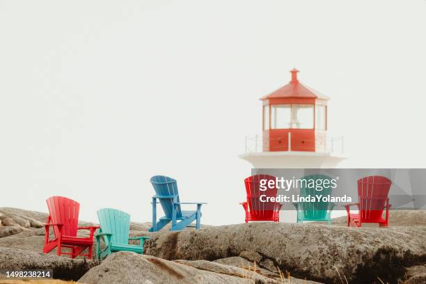 chairs and lighthouse at peggy's cove, nova scotia - peggy's cove stock pictures, royalty-free photos & images