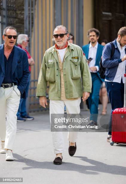 Alessandro Squarzi wears green jacket, white pants during Pitti Immagine Uomo 104 on June 13, 2023 in Florence, Italy.