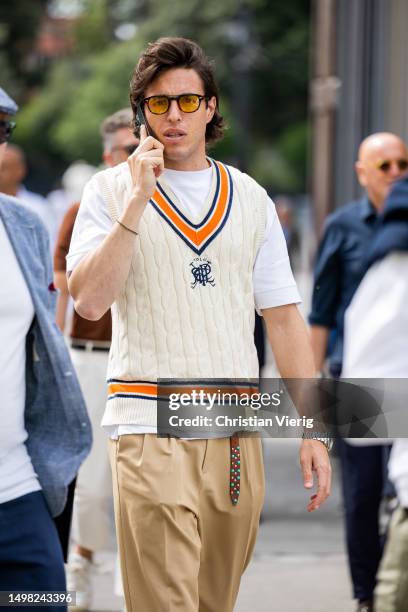 Guest wears v neck pullunder during Pitti Immagine Uomo 104 on June 13, 2023 in Florence, Italy.