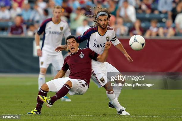 Martin Rivero of Colorado Rapids is fouled by Kyle Beckerman of Real Salt Lake as they battle for control of the ball at Dick's Sporting Goods Park...