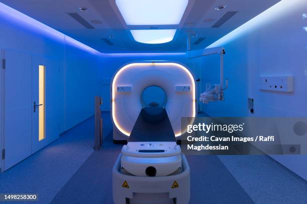 view of a scanner room bathed in blue light - hospital machine bildbanksfoton och bilder