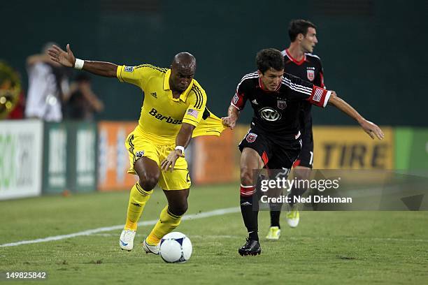 Emilio Renteria of the Columbus Crew controls the ball against Lewis Neal of D.C. United at RFK Stadium on August 4, 2012 in Washington, DC.