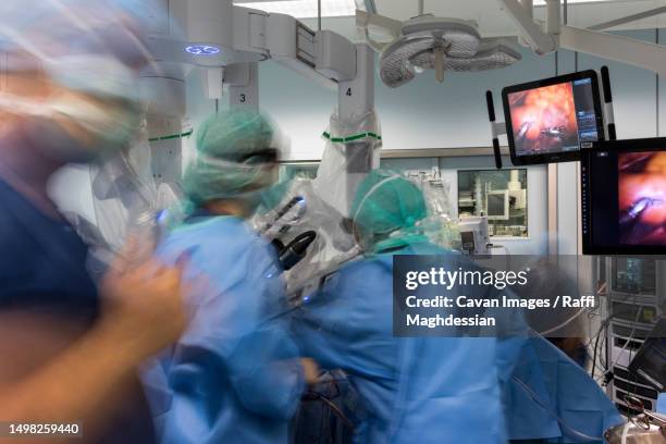 a group of surgeons are busy in the operating room - operating room ストックフォトと画像