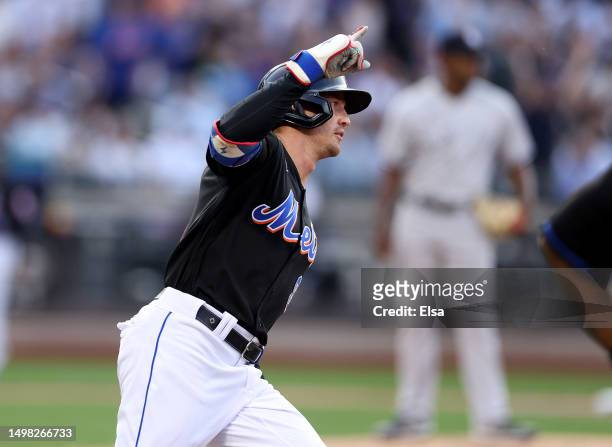 Brandon Nimmo of the New York Mets celebrates his solo home run in the first inning as Luis Severino of the New York Yankees looks on at Citi Field...