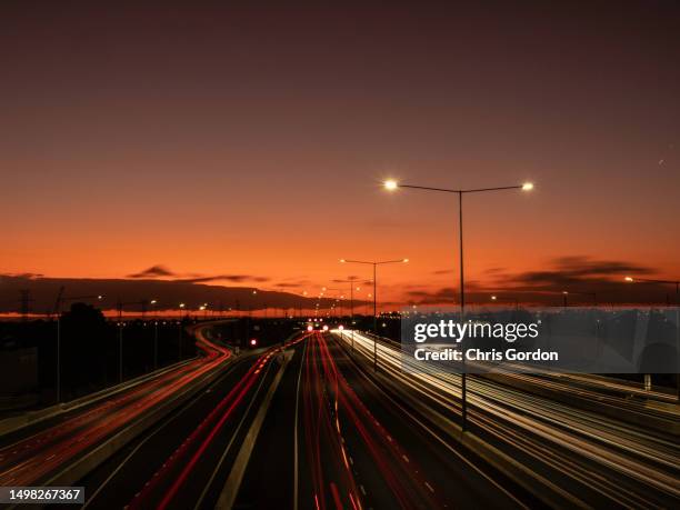 multi lane freeway at sunset - melbourne star stock pictures, royalty-free photos & images