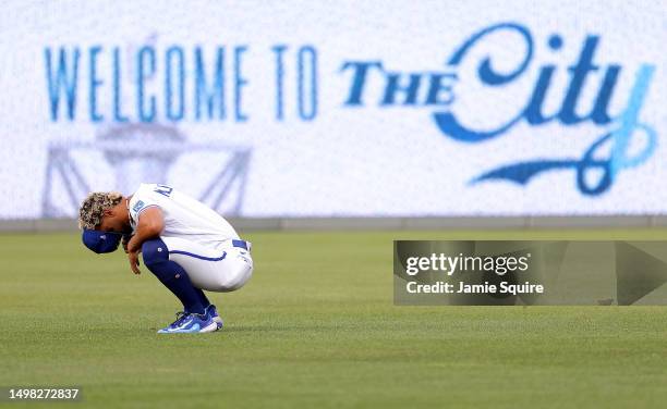 Melendez of the Kansas City Royals prays in the outfield while warming up prior to the game against the Cincinnati Reds at Kauffman Stadium on June...