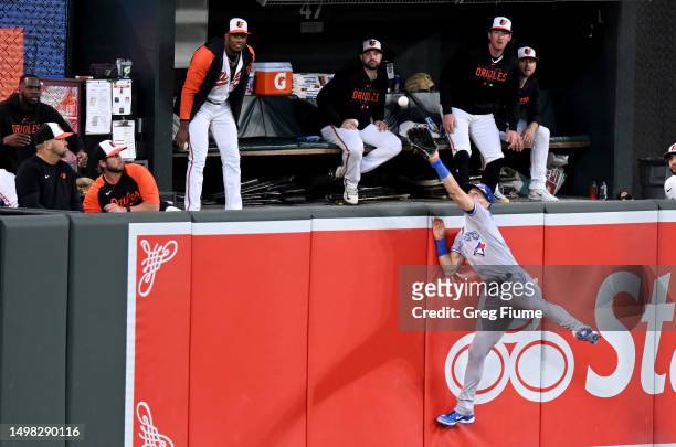 Kevin Kiermaier of the Toronto Blue Jays tries to catch a home run hit by Gunnar Henderson of the Baltimore Orioles in the third inning at Oriole...