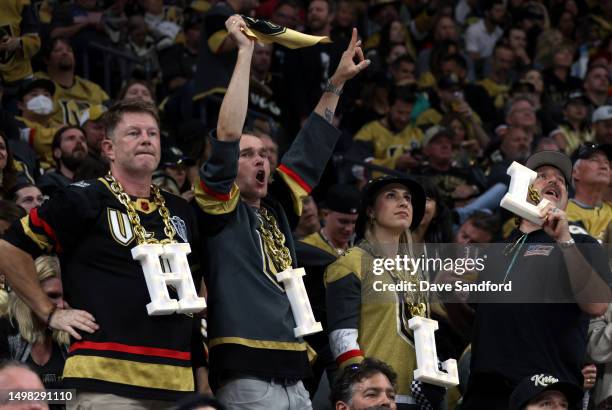 Fans of goaltender Adin Hill of the Vegas Golden Knights cheer on during the third period of Game Five of the 2023 NHL Stanley Cup Final between the...