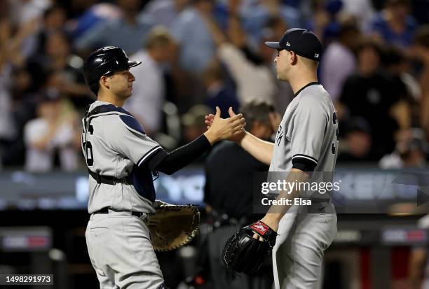 Michael King and Kyle Higashioka of the New York Yankees celebrate the win over the New York Mets at Citi Field on June 13, 2023 in the Flushing...