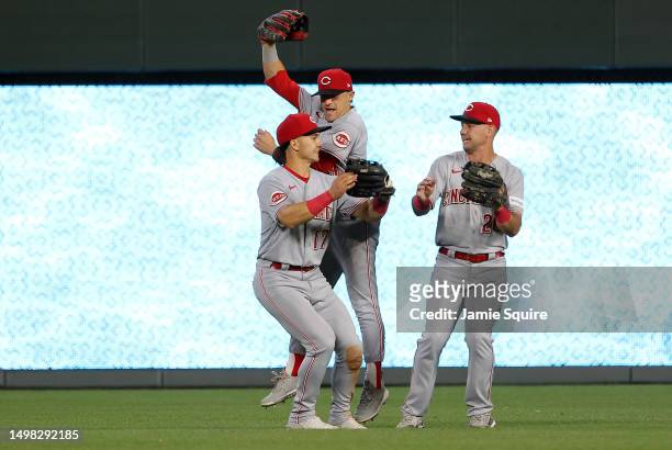 Stuart Fairchild, TJ Friedl and T.J. Hopkins of the Cincinnati Reds celebrate after the Reds defeated the Kansas City Royals 5-4 to win the game at...