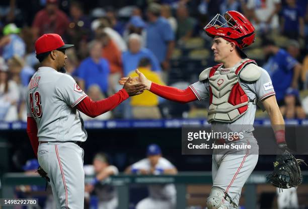 Alexis Diaz and Tyler Stephenson of the Cincinnati Reds congratulate each other after the Reds defeated the Kansas City Royals 5-4 to win the game at...