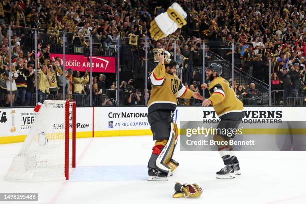 Adin Hill of the Vegas Golden Knights and Brayden McNabb of the Vegas Golden Knights celebrate a championship win against the Florida Panthers in...