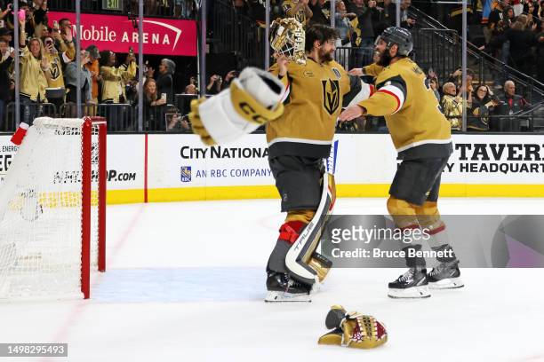Adin Hill of the Vegas Golden Knights and Brayden McNabb of the Vegas Golden Knights celebrate a championship win against the Florida Panthers in...