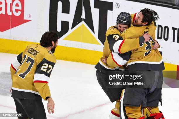 Adin Hill of the Vegas Golden Knights and Brayden McNabb of the Vegas Golden Knights celebrate a championship win against the Florida Panthers in...