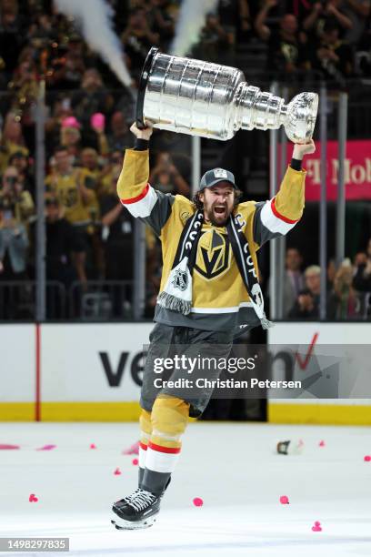 Mark Stone of the Vegas Golden Knights hoists the Stanley Cup after defeating the Florida Panthers to win the championship in Game Five of the 2023...