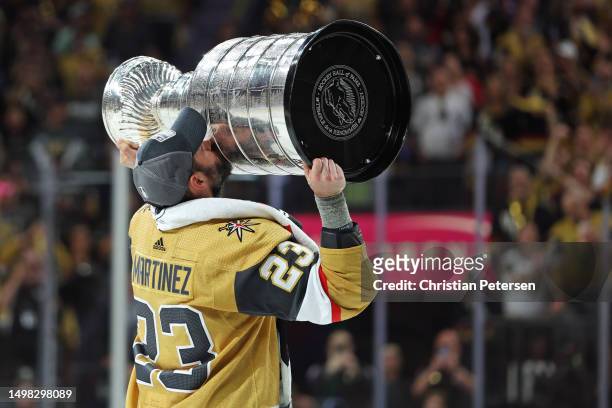 Alec Martinez of the Vegas Golden Knights kisses the Stanley Cup after defeating the Florida Panthers to win the championship in Game Five of the...