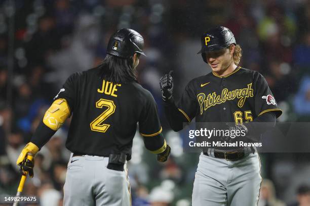 Jack Suwinski of the Pittsburgh Pirates celebrates with Connor Joe after hitting a solo home run during the sixth inning against the Chicago Cubs at...