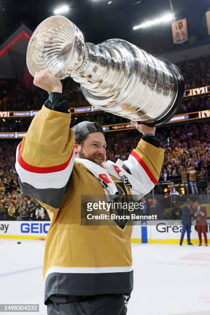 Laurent Brossoit of the Vegas Golden Knights hoists the Stanley Cup after defeating the Florida Panthers to win the championship in Game Five of the...