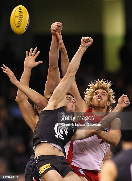 Lewis Roberts Thomson of the Swans contests for the mark during the round 19 AFL match between the Carlton Blues and the Sydney Swans at Etihad...