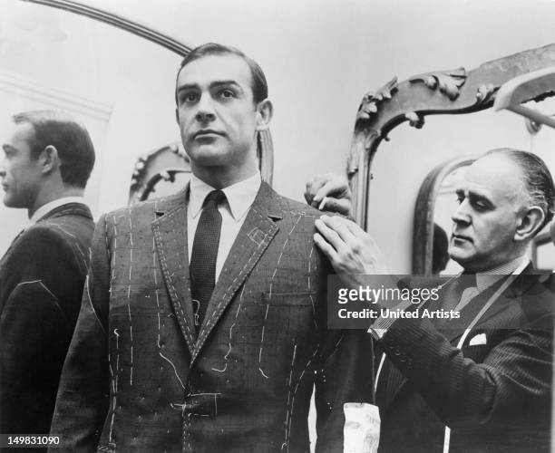Tailor Anthony Sinclair fitting Scottish actor Sean Connery for one of the suits he will wear in the film 'From Russia With Love', Mayfair, London,...
