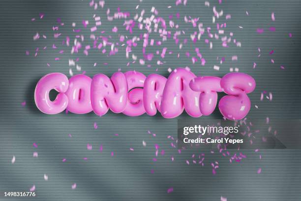 congrats text  in 3d pink letters with golden confetti - balloon letters stock pictures, royalty-free photos & images