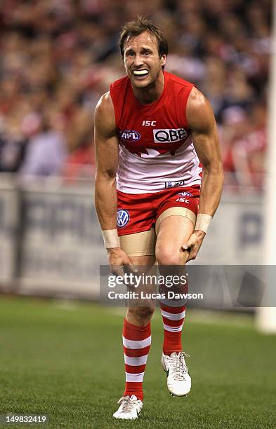 Jude Bolton of Swans holds his knee during the round 19 AFL match between the Carlton Blues and the Sydney Swans at Etihad Stadium on August 5, 2012...